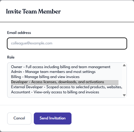 Invite Team Member dialog with the Role dropdown showing all six role options and their descriptions